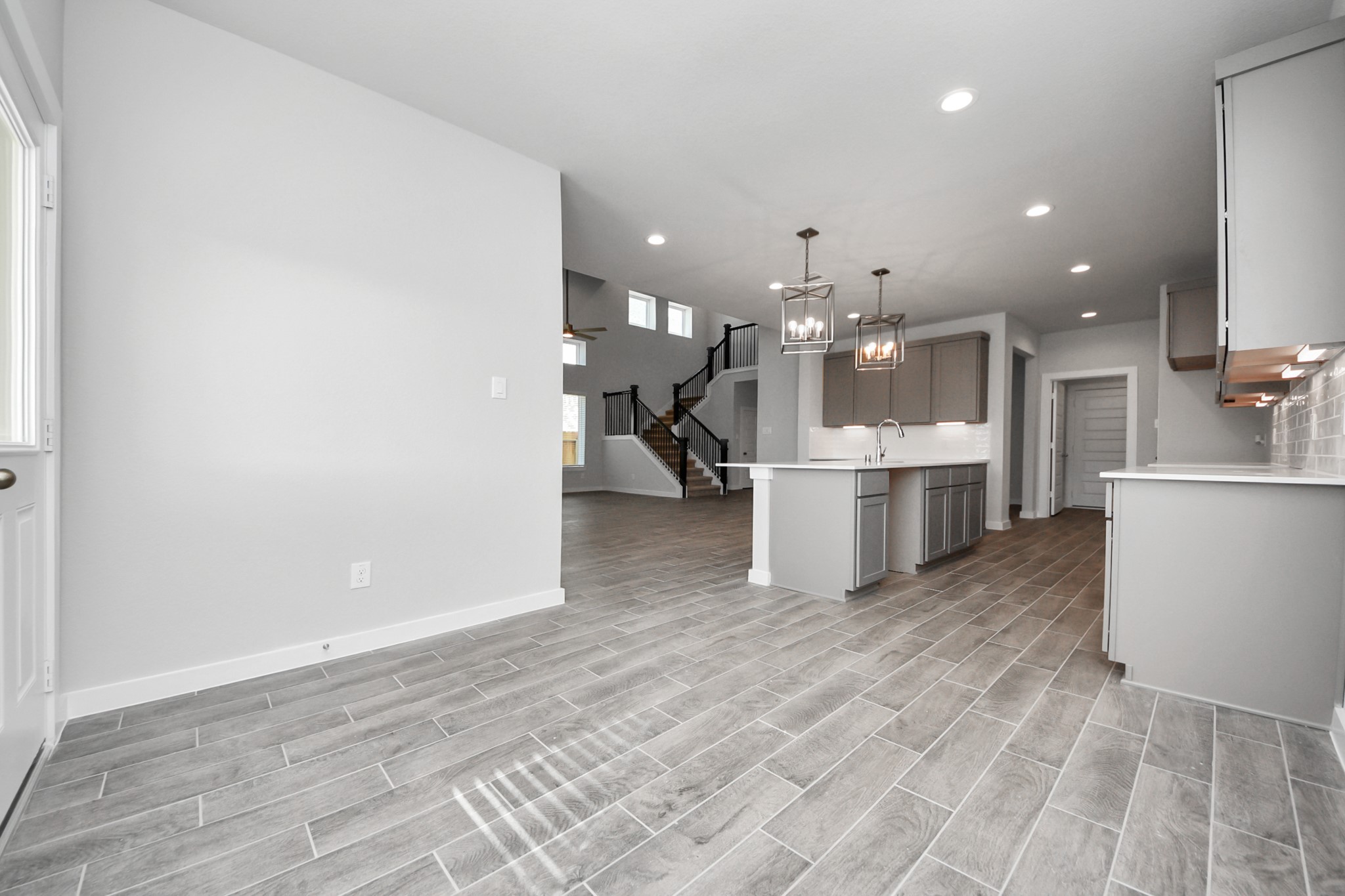 3002 Bury Park Dr Spring Spring, TX 77373 - Photo 22 of 45 a view of a kitchen with a sink and wooden floor