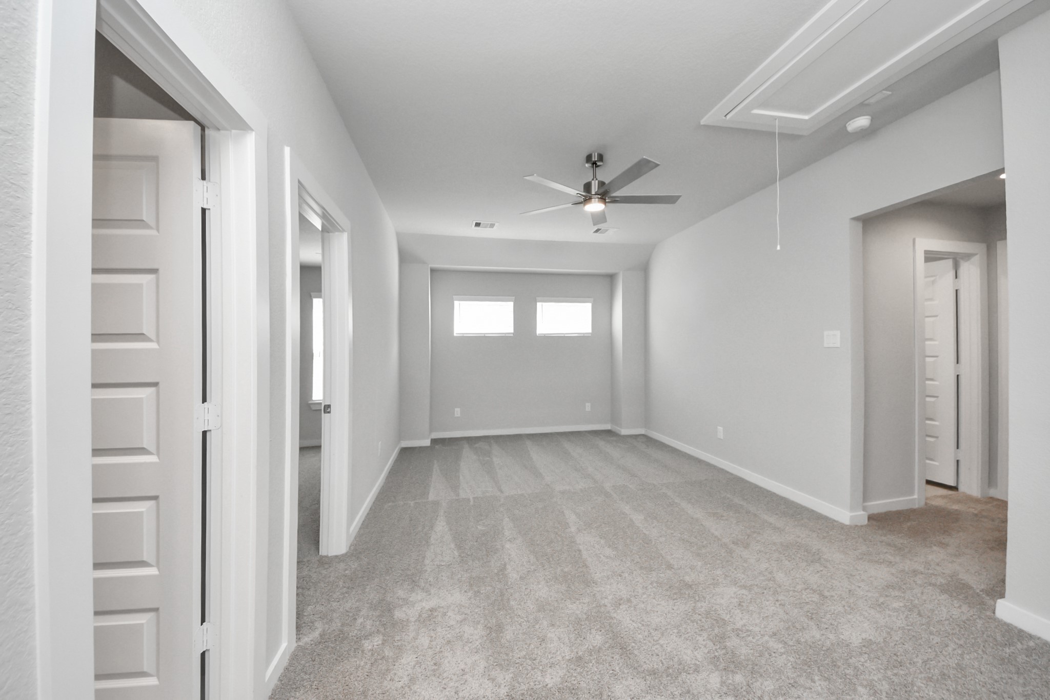 3002 Bury Park Dr Spring Spring, TX 77373 - Photo 31 of 45 Ascend to relaxation in this fantastic game room! Ideal for both casual gatherings and adult gaming, it boasts plush carpet, lofty ceilings, custom paint, and ample windows for abundant natural light.