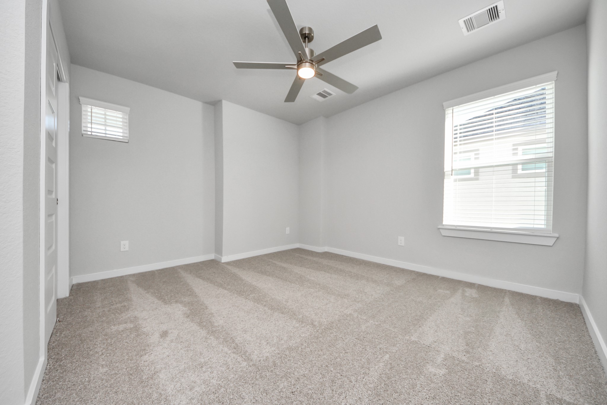 3002 Bury Park Dr Spring Spring, TX 77373 - Photo 37 of 45 an empty room with a window and a ceiling fan