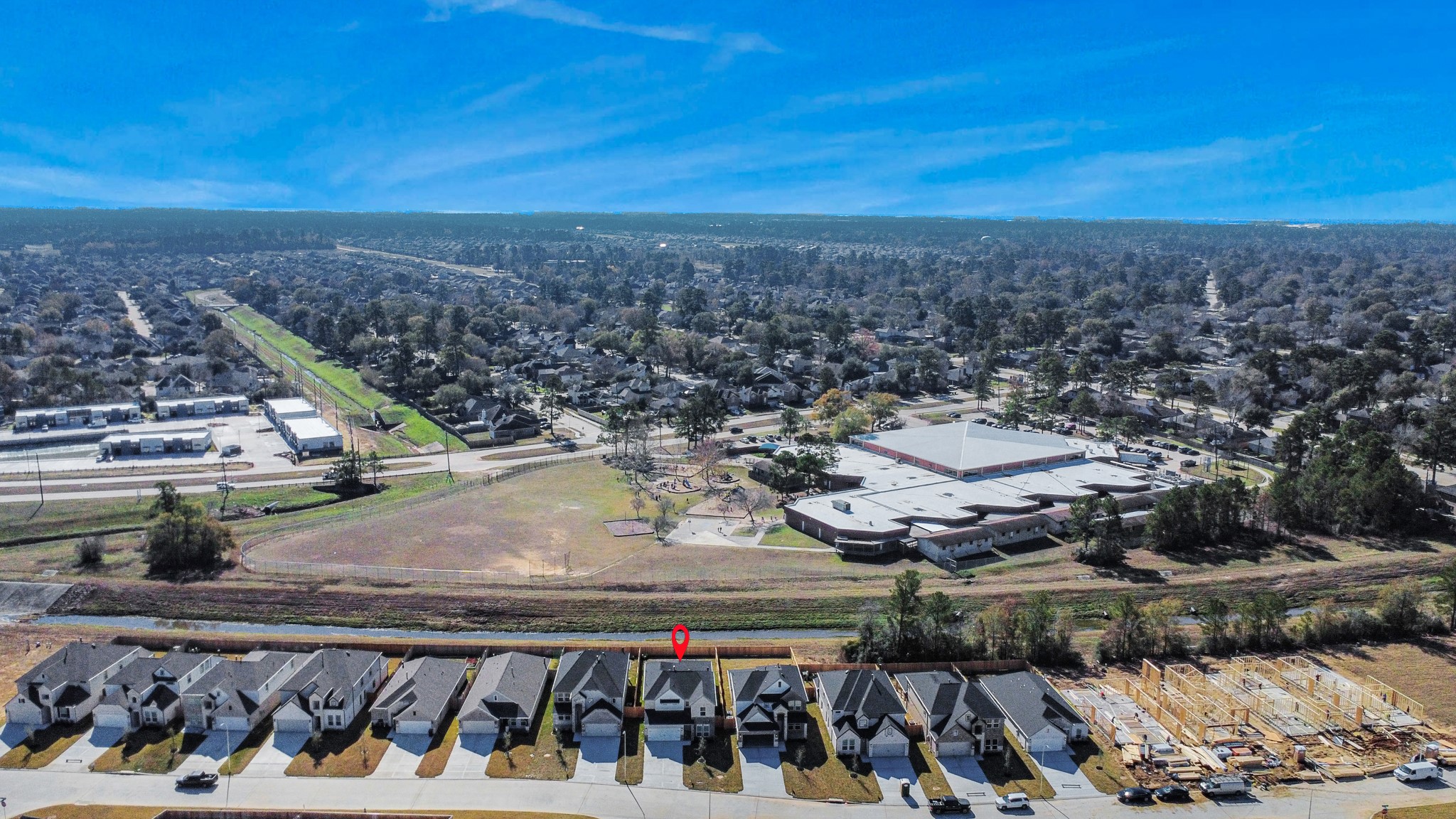 3002 Bury Park Dr Spring Spring, TX 77373 - Photo 4 of 45 An aerial view of a spacious subdivision lot, highlighting a well-maintained yard and a fully fenced perimeter, offering both privacy and expansive outdoor space.