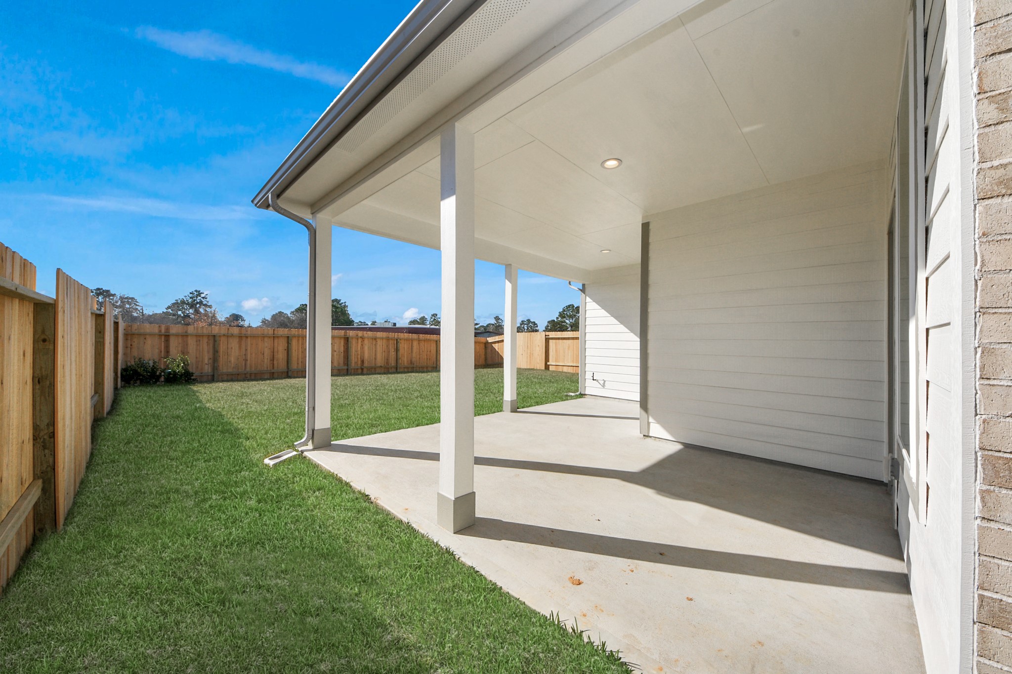 3002 Bury Park Dr Spring Spring, TX 77373 - Photo 42 of 45 Experience outdoor living at its finest on this expansive covered patio, thoughtfully designed for BBQs and delightful outdoor dining.