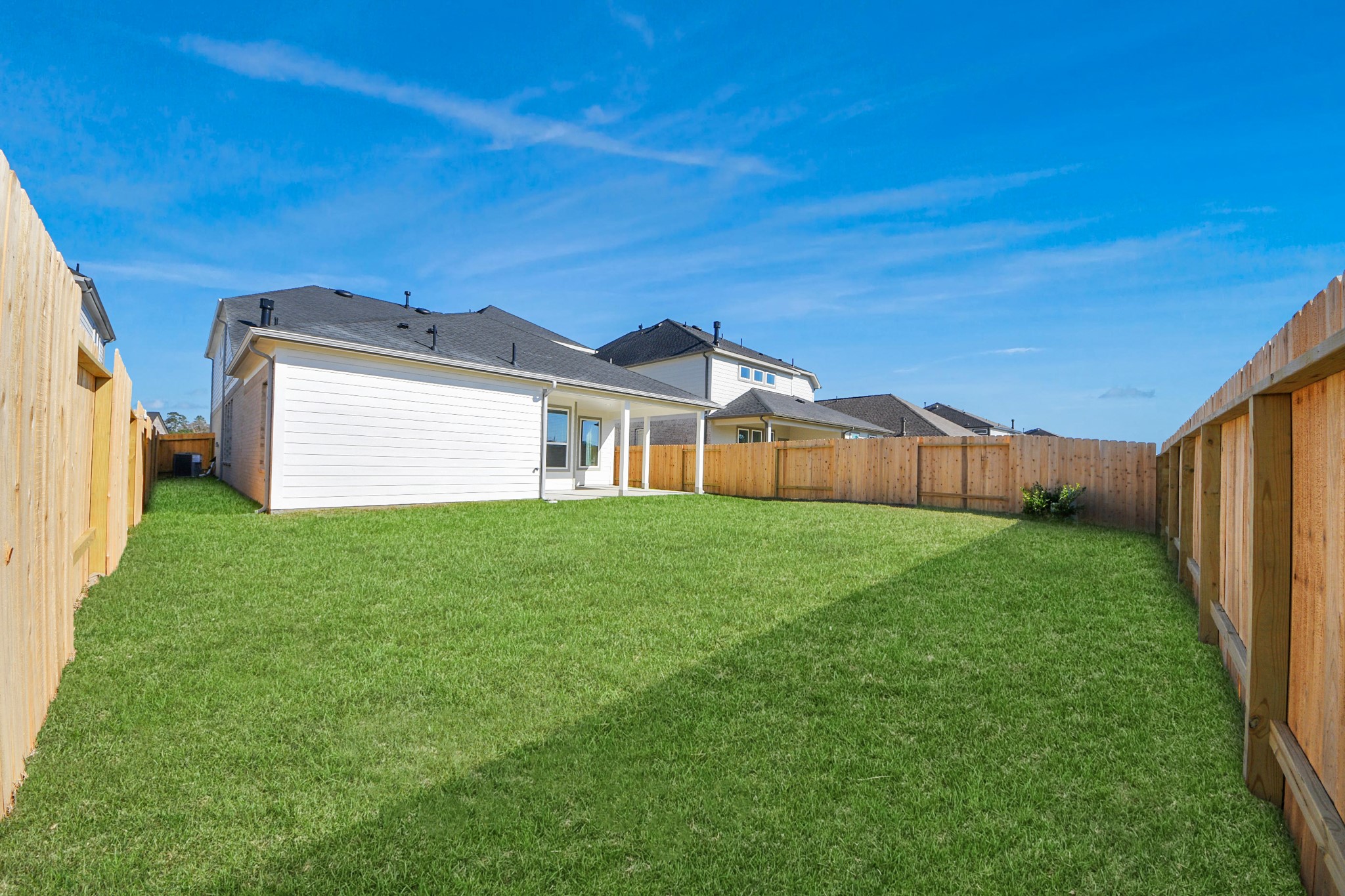 3002 Bury Park Dr Spring Spring, TX 77373 - Photo 44 of 45 a view of a backyard with plants and a garden