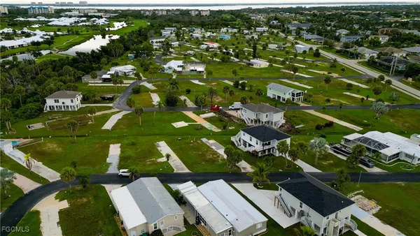 an aerial view of residential houses with outdoor space