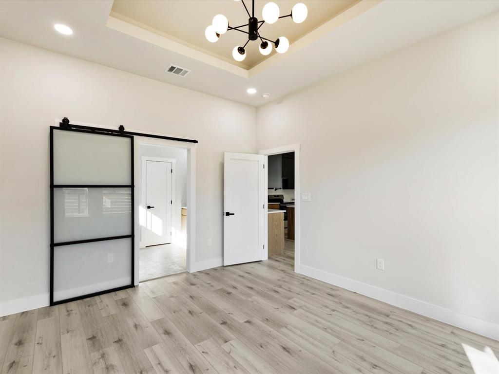 6147 Inca Drive Mabank, TX 75156 - Photo 11 of 38 a view of a livingroom with a chandelier fan and wooden floor