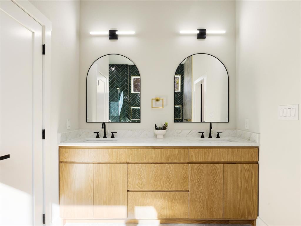 6147 Inca Drive Mabank, TX 75156 - Photo 13 of 38 a bathroom with a double vanity sink and mirror