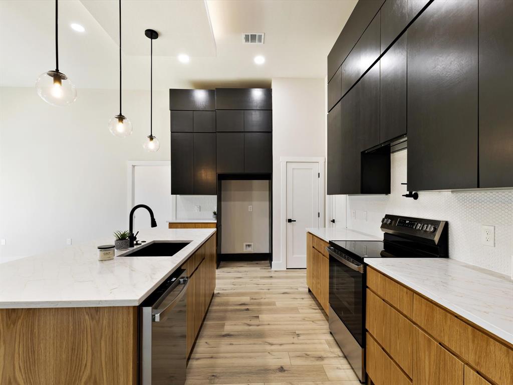 6147 Inca Drive Mabank, TX 75156 - Photo 16 of 38 a kitchen with stainless steel appliances a sink stove and refrigerator