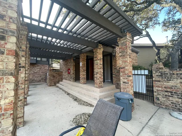 a view of dinning table and chairs in patio