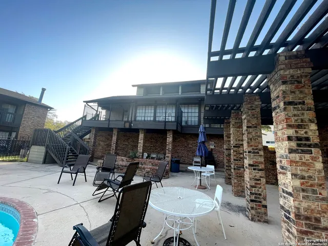 a view of a swimming pool with a patio