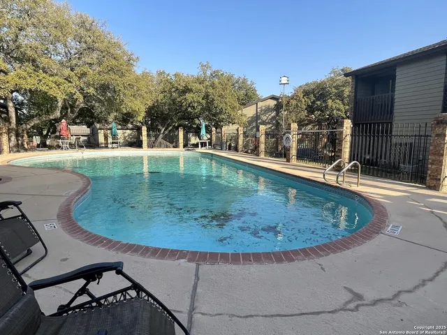 a view of a house with backyard porch and sitting area