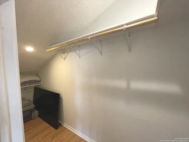 a bathroom with a shower and a toilet