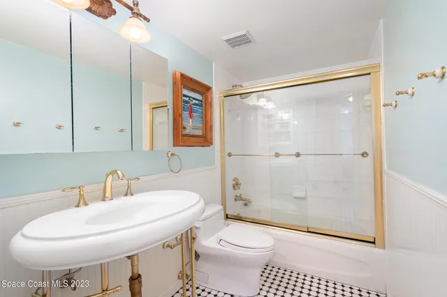 a bedroom with a bed and a dresser in it