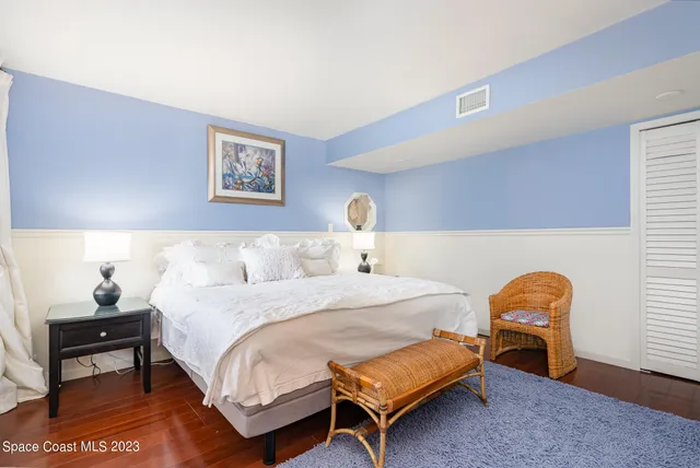 a bedroom with a bed and dresser