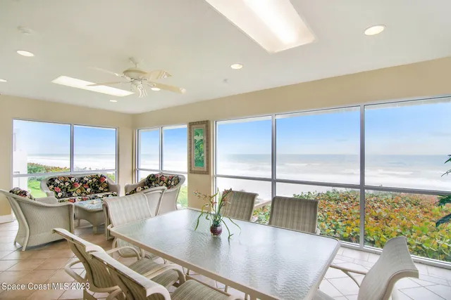 a kitchen with granite countertop a sink and a refrigerator