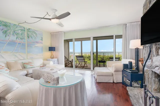 a living room with furniture fireplace and a flat screen tv