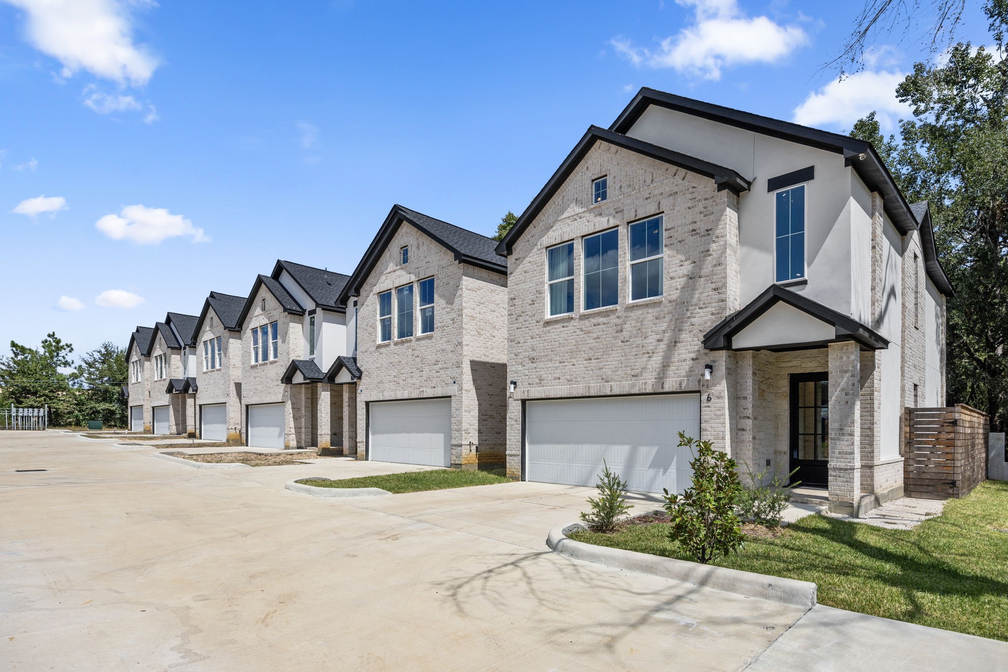 7934 Hennessy Lane, Unit 1 Spring, TX 77389 - Photo 7 of 36 a front view of a house with a yard and garage