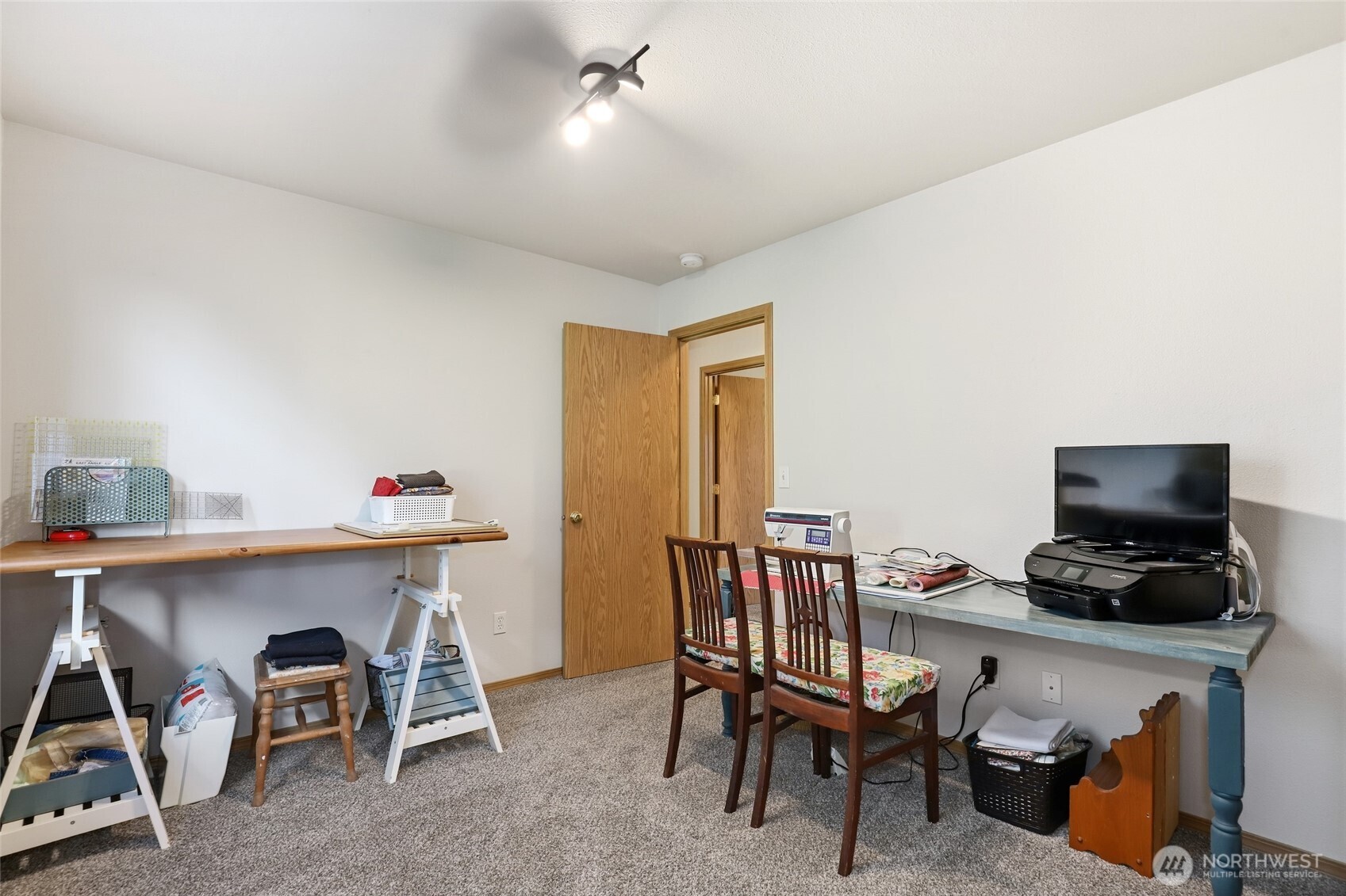 8008 188th Avenue Southwest Rochester, WA 98579 - Photo 25 of 40 a view of a workspace with furniture and a window