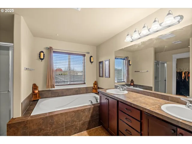 a bathroom with a toilet sink and shower