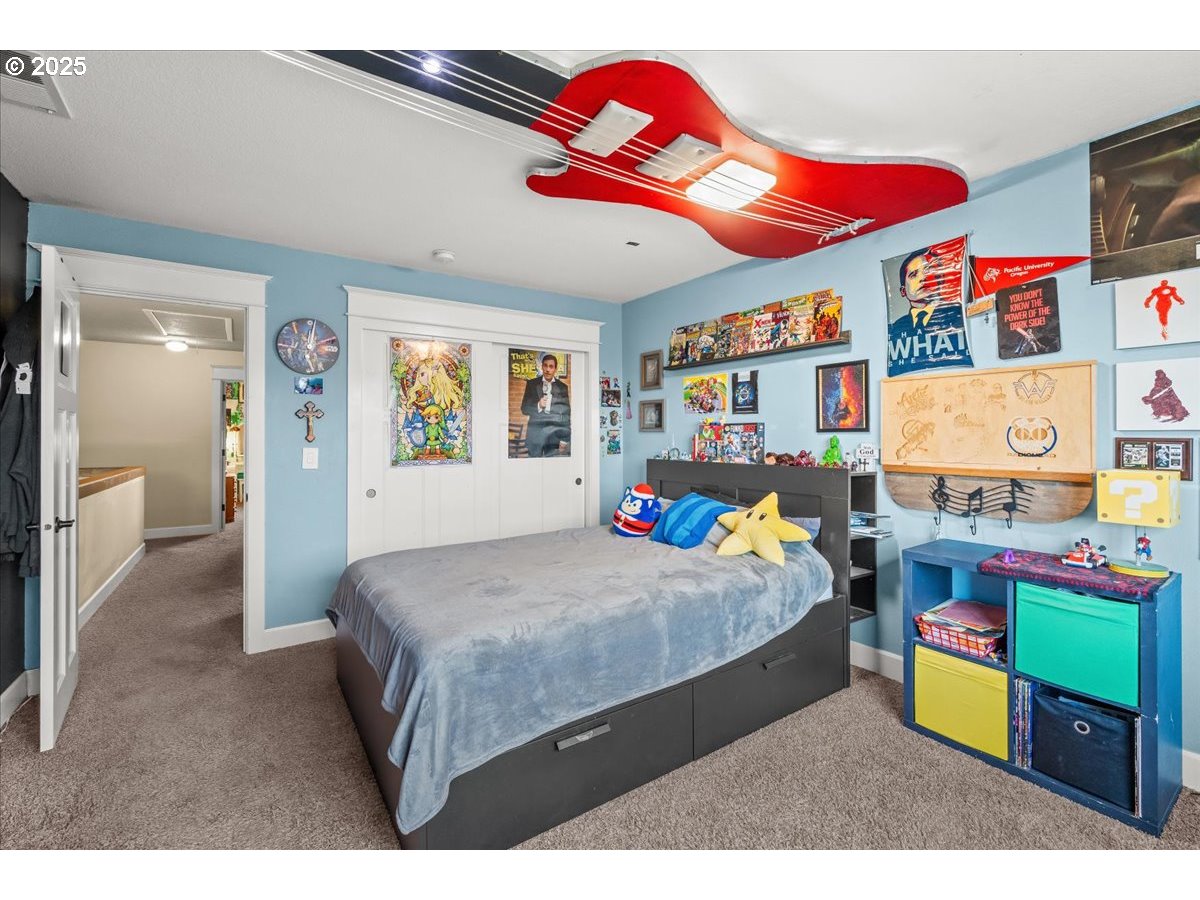 1138 37th Avenue Forest Grove, OR 97116 - Photo 33 of 48 a bedroom with a bed and dresser