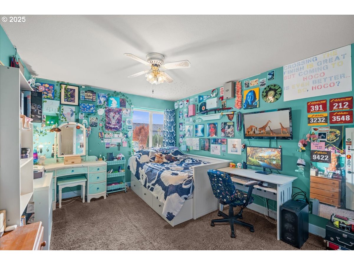 1138 37th Avenue Forest Grove, OR 97116 - Photo 34 of 48 a bed room with furniture and a chandelier