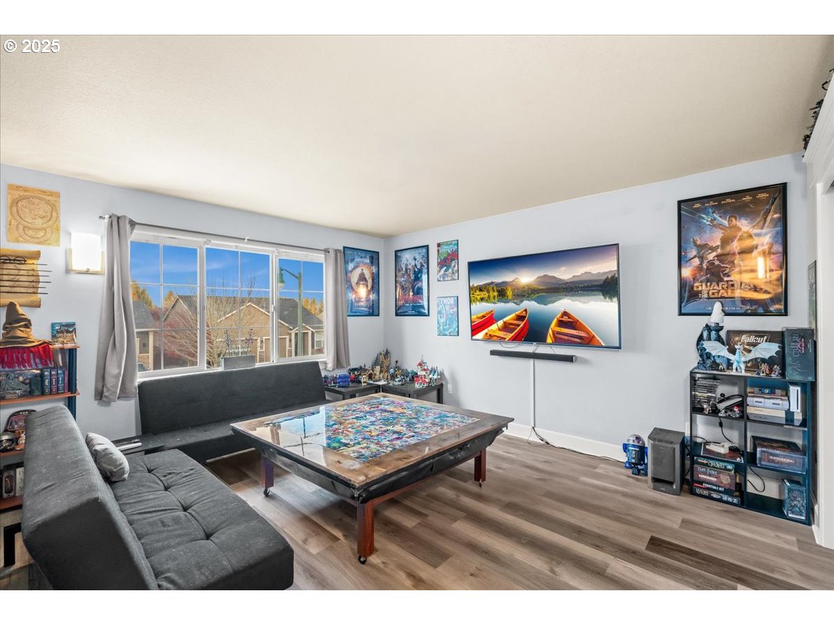 1138 37th Avenue Forest Grove, OR 97116 - Photo 35 of 48 a living room with furniture and a flat screen tv
