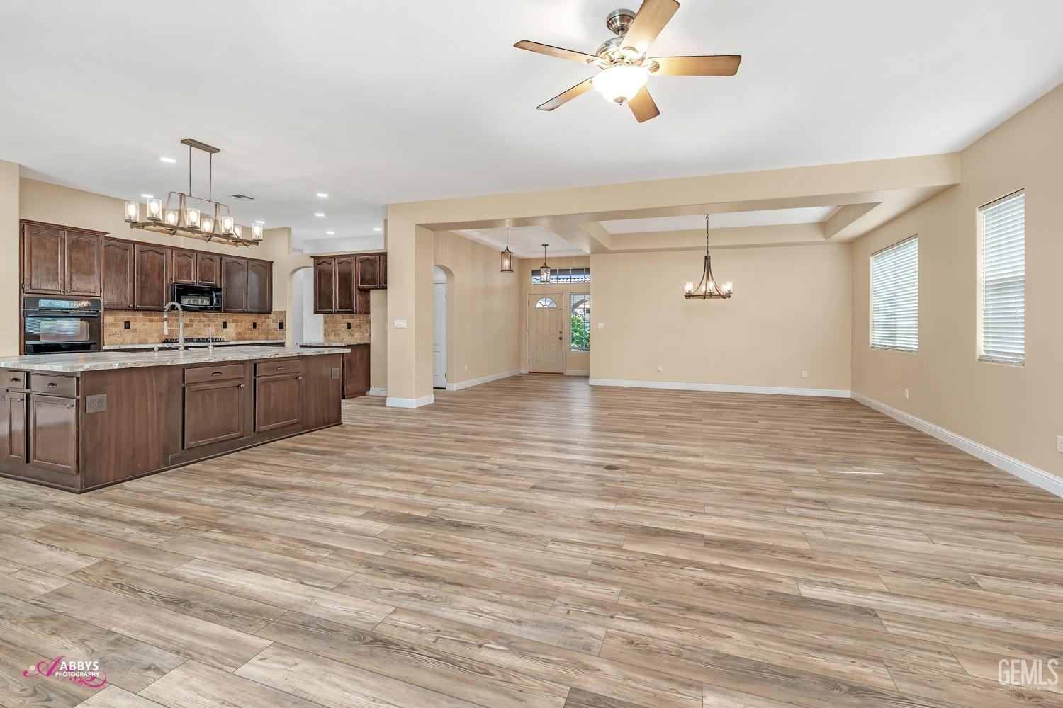 Undisclosed Address Bakersfield, CA 93311 - Photo 13 of 41 a view of a kitchen with a sink and cabinets