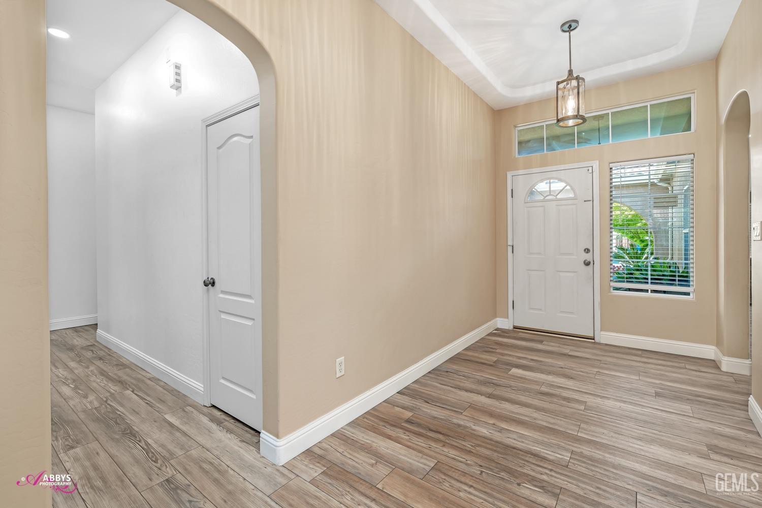 Undisclosed Address Bakersfield, CA 93311 - Photo 21 of 41 a view of a room with wooden floor and windows