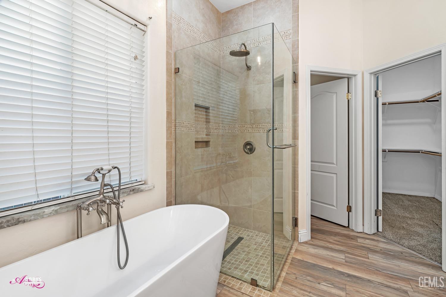 Undisclosed Address Bakersfield, CA 93311 - Photo 24 of 41 a bathroom with a tub a sink and a shower