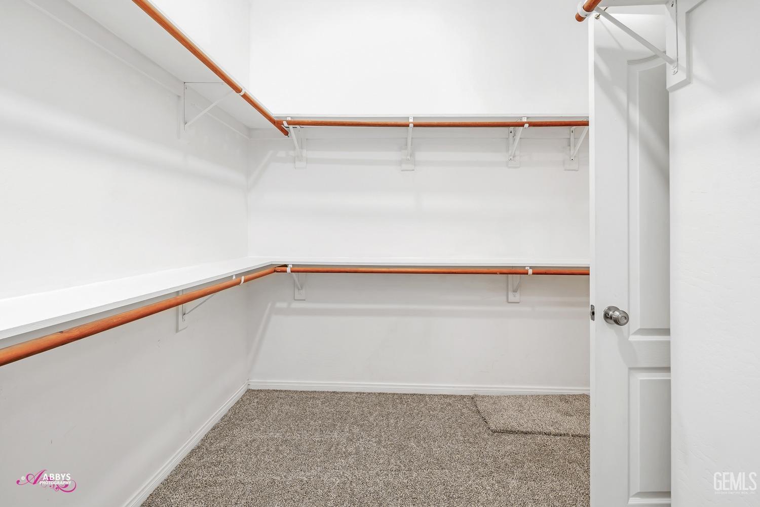 Undisclosed Address Bakersfield, CA 93311 - Photo 25 of 41 a view of walk in closet with clothes