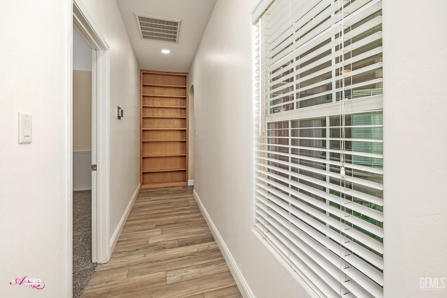 Undisclosed Address Bakersfield, CA 93311 - Photo 26 of 41 a view of a hallway with stairs and a window
