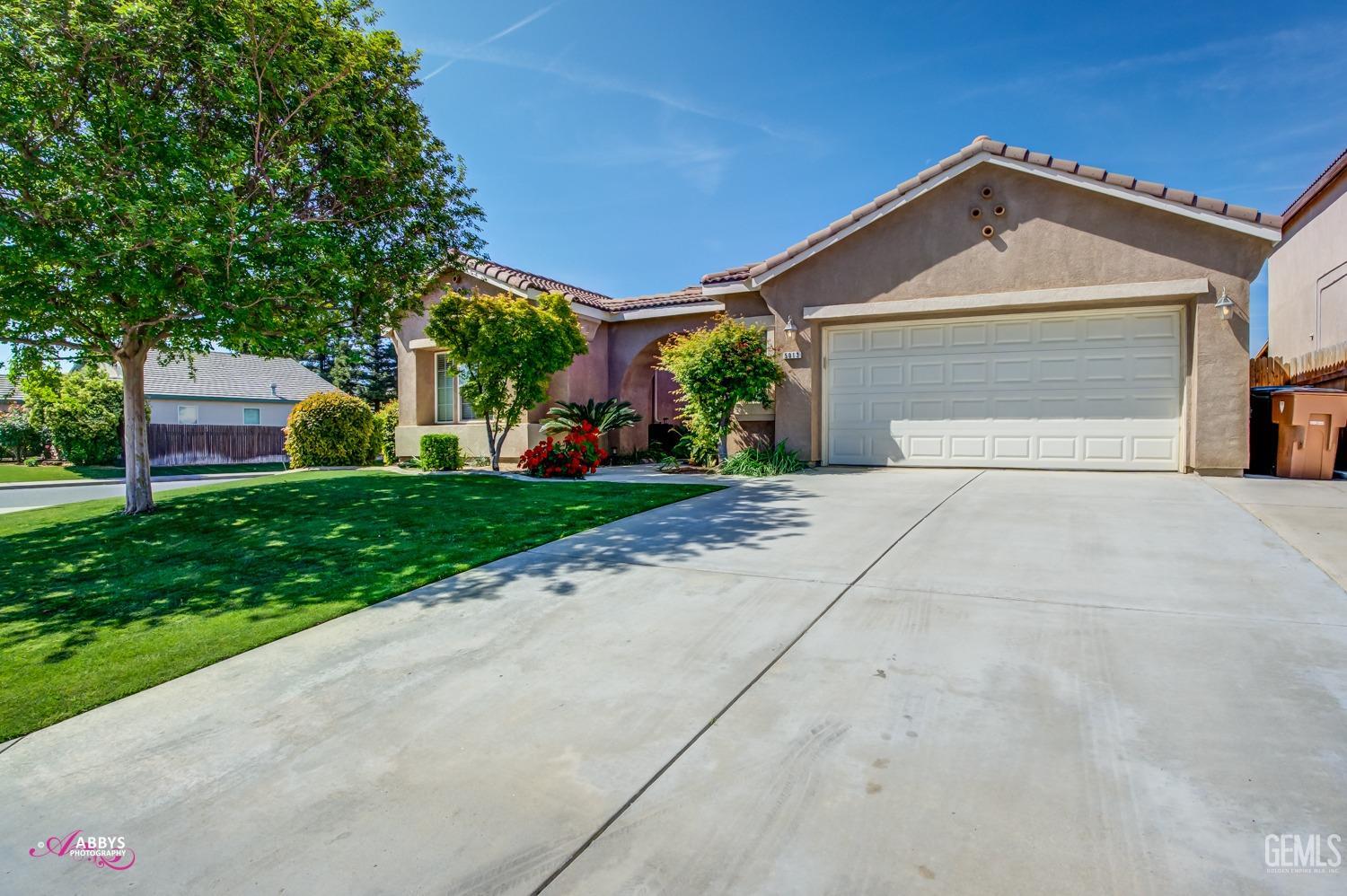 Undisclosed Address Bakersfield, CA 93311 - Photo 3 of 41 a front view of a house with a yard