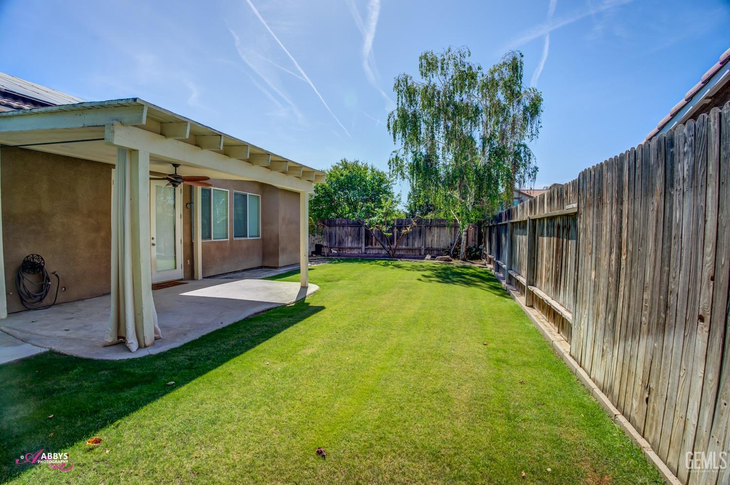 Undisclosed Address Bakersfield, CA 93311 - Photo 33 of 41 a view of a house with backyard and porch
