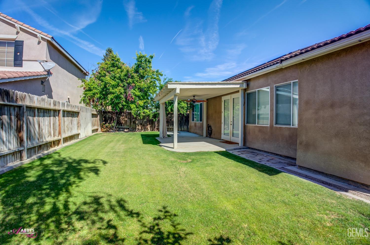Undisclosed Address Bakersfield, CA 93311 - Photo 36 of 41 a view of an house with backyard and porch