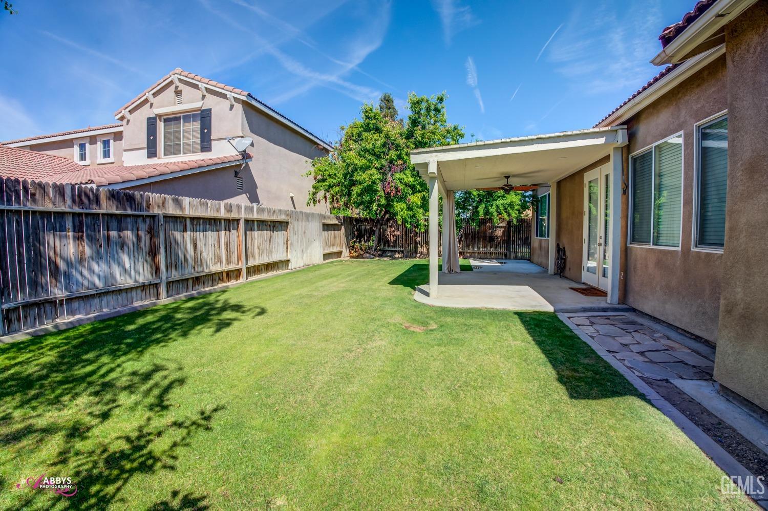 Undisclosed Address Bakersfield, CA 93311 - Photo 37 of 41 a front view of a house with garden