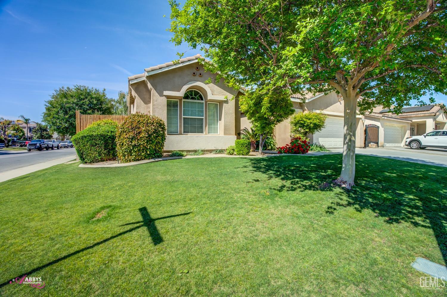 Undisclosed Address Bakersfield, CA 93311 - Photo 4 of 41 a view of a house with backyard and garden