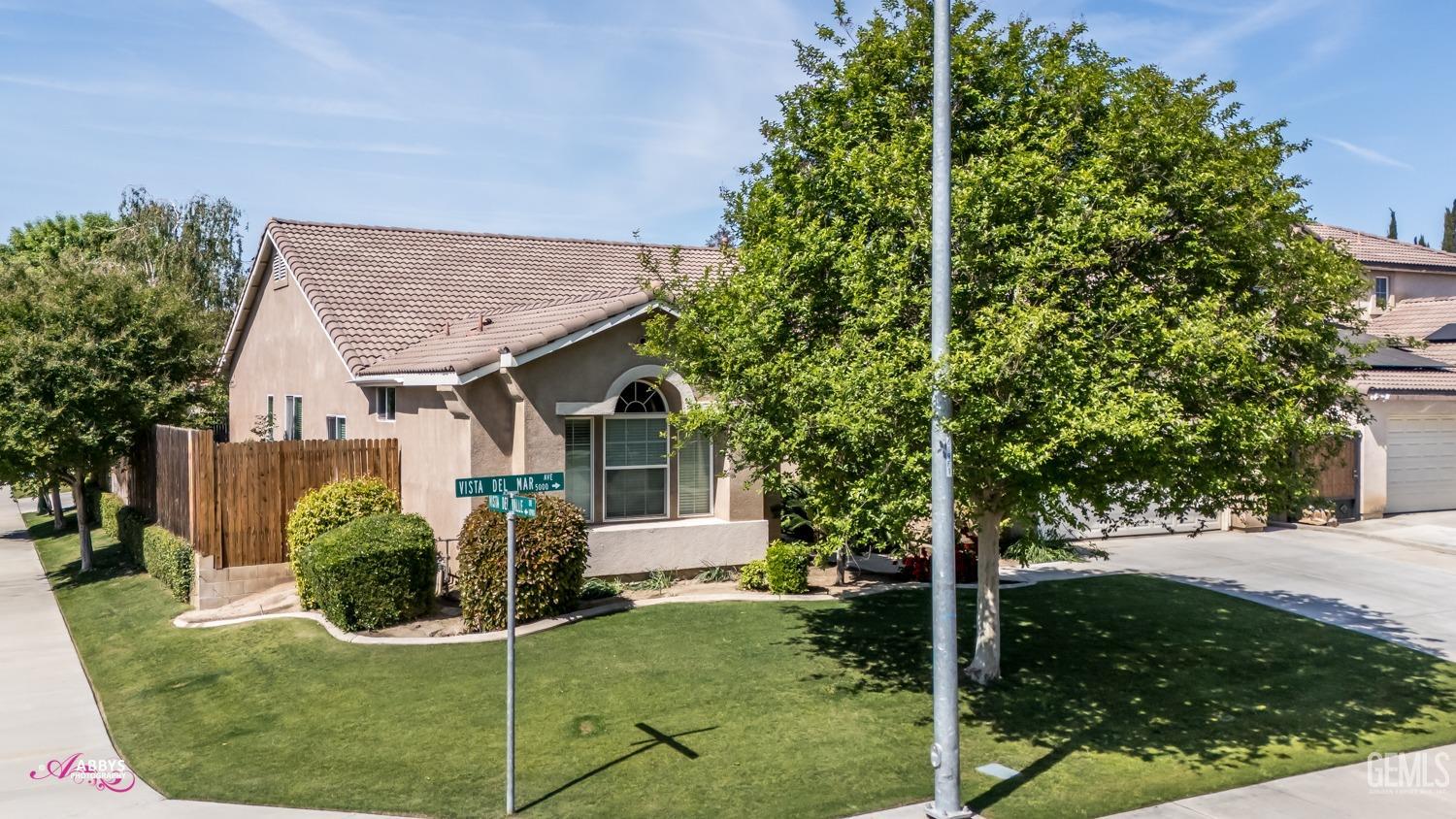 Undisclosed Address Bakersfield, CA 93311 - Photo 6 of 41 a front view of a house with garden
