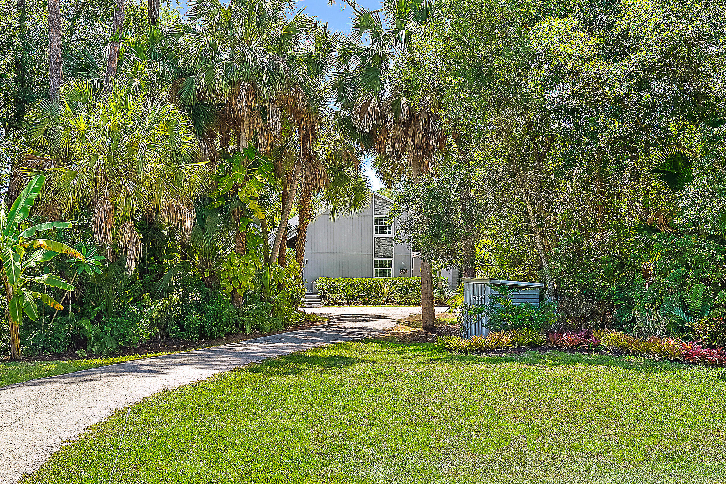 15629 95th Avenue North Jupiter, FL 33478 - Photo 1 of 25 a view of a house with backyard and a tree