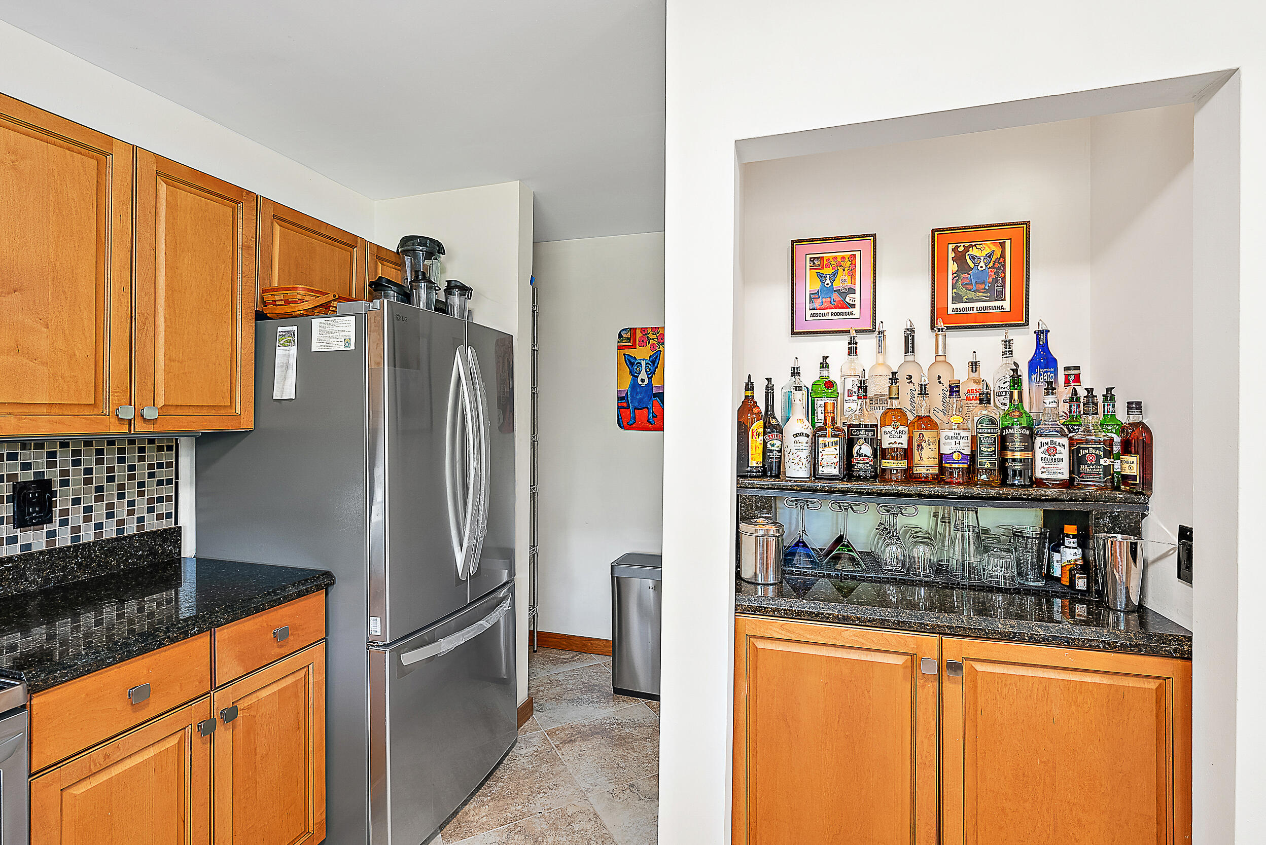 15629 95th Avenue North Jupiter, FL 33478 - Photo 11 of 25 a kitchen with stainless steel appliances granite countertop a refrigerator and a sink