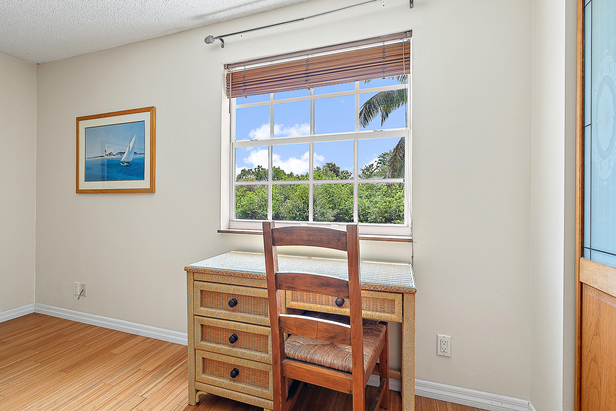 15629 95th Avenue North Jupiter, FL 33478 - Photo 16 of 25 a view of a bedroom with a bed and a window
