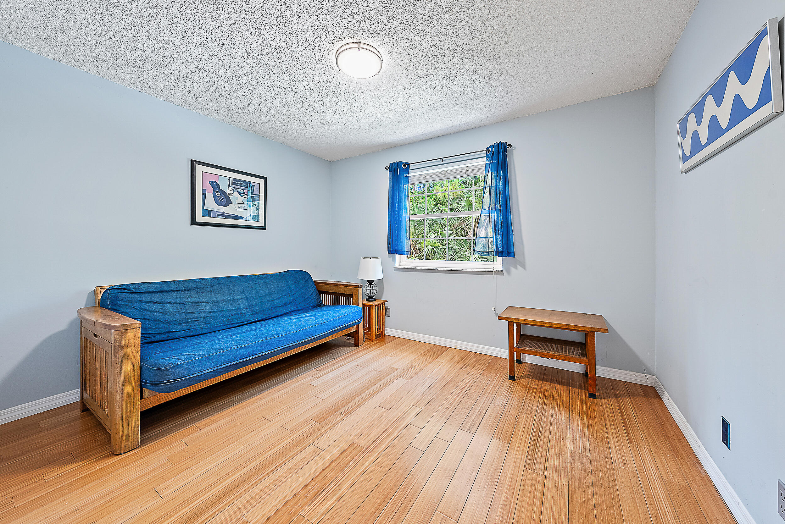 15629 95th Avenue North Jupiter, FL 33478 - Photo 18 of 25 a bedroom with a bed and a workspace