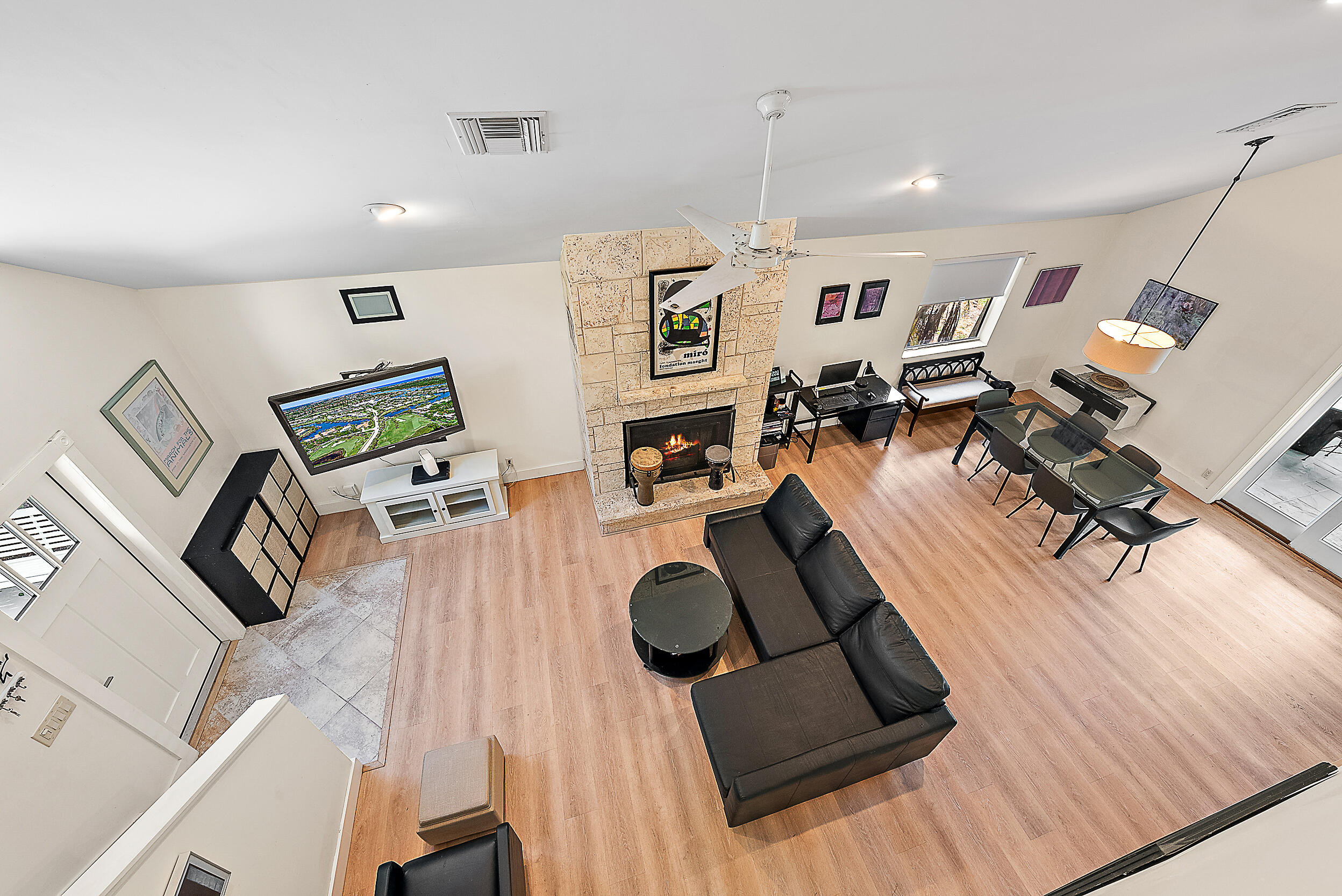 15629 95th Avenue North Jupiter, FL 33478 - Photo 2 of 25 a living room with furniture and a wooden floor