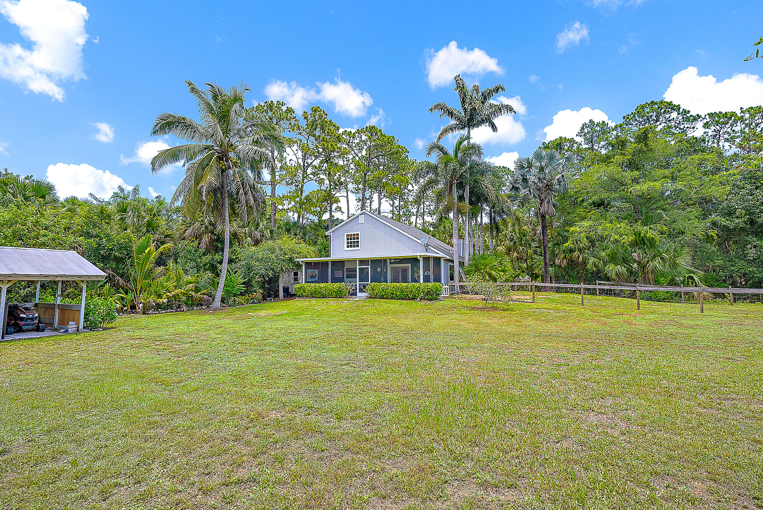 15629 95th Avenue North Jupiter, FL 33478 - Photo 23 of 25 a house view with a swimming pool
