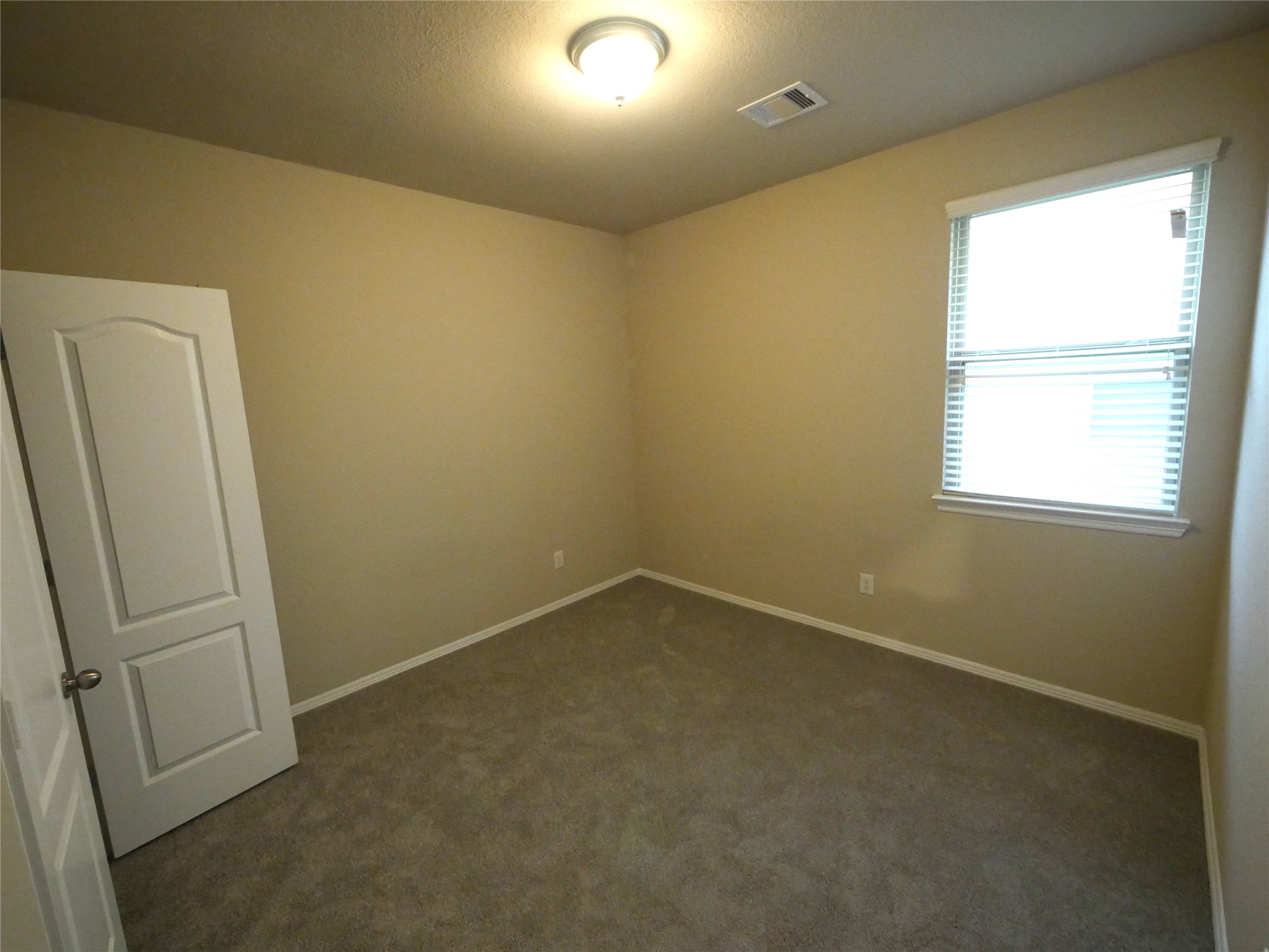 9843 Swindale Ridge Lane Houston, TX 77044 - Photo 12 of 17 Well-sized secondary bedrooms offering flexibility for family, guests, a home office, or personal space.