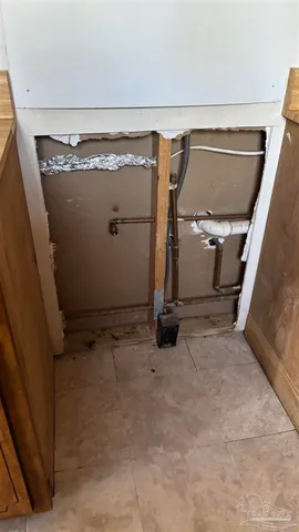 a kitchen with a sink cabinets and a window