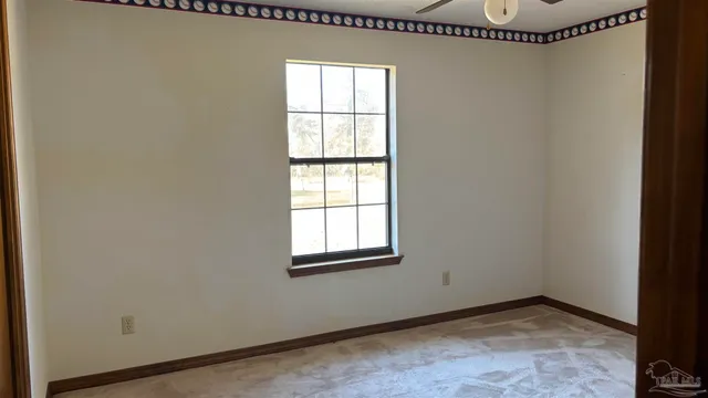 a white toilet sitting next to a bath tub