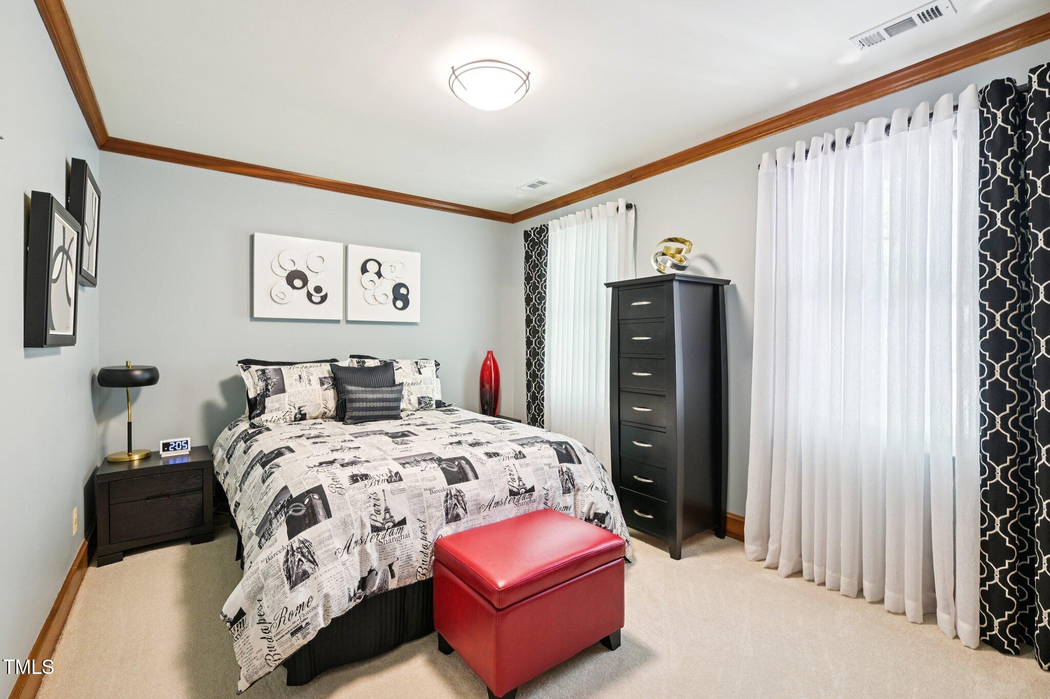 3413 1st Place Raleigh, NC 27613 - Photo 22 of 43 a bedroom with a bed and a closet