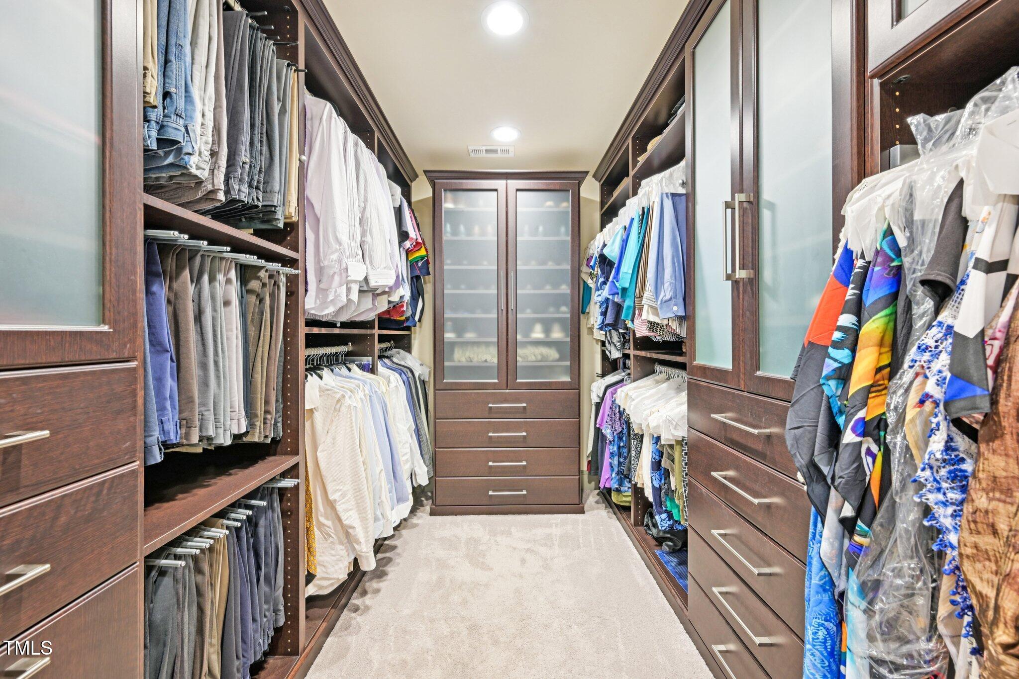 3413 1st Place Raleigh, NC 27613 - Photo 27 of 43 a view of walk in closet with clothes and shoes