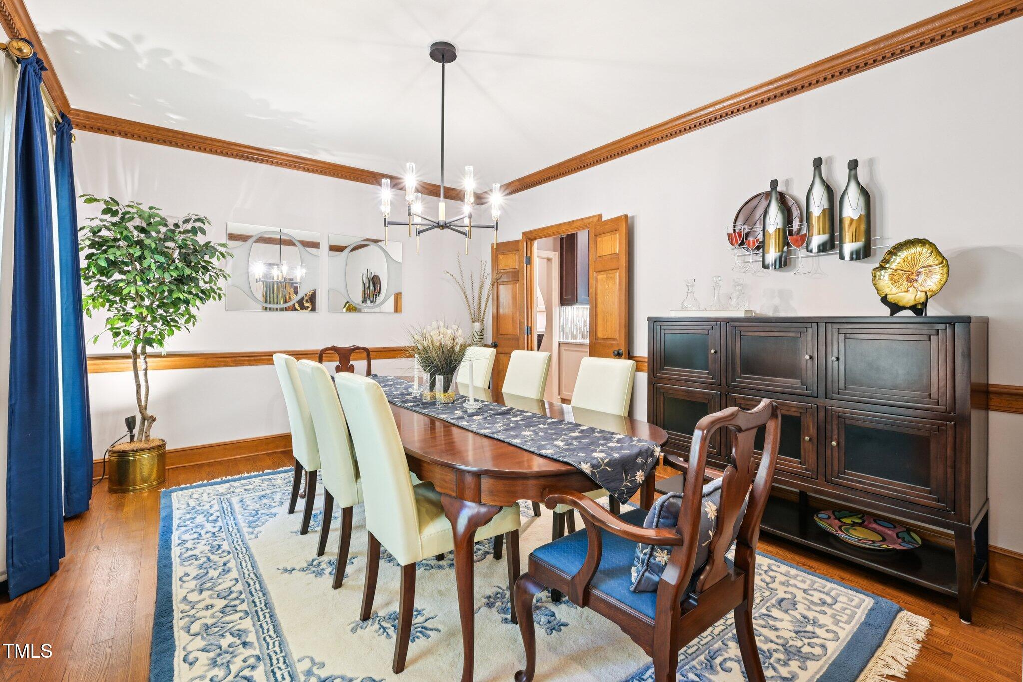 3413 1st Place Raleigh, NC 27613 - Photo 9 of 43 a view of a dining room with furniture window and wooden floor