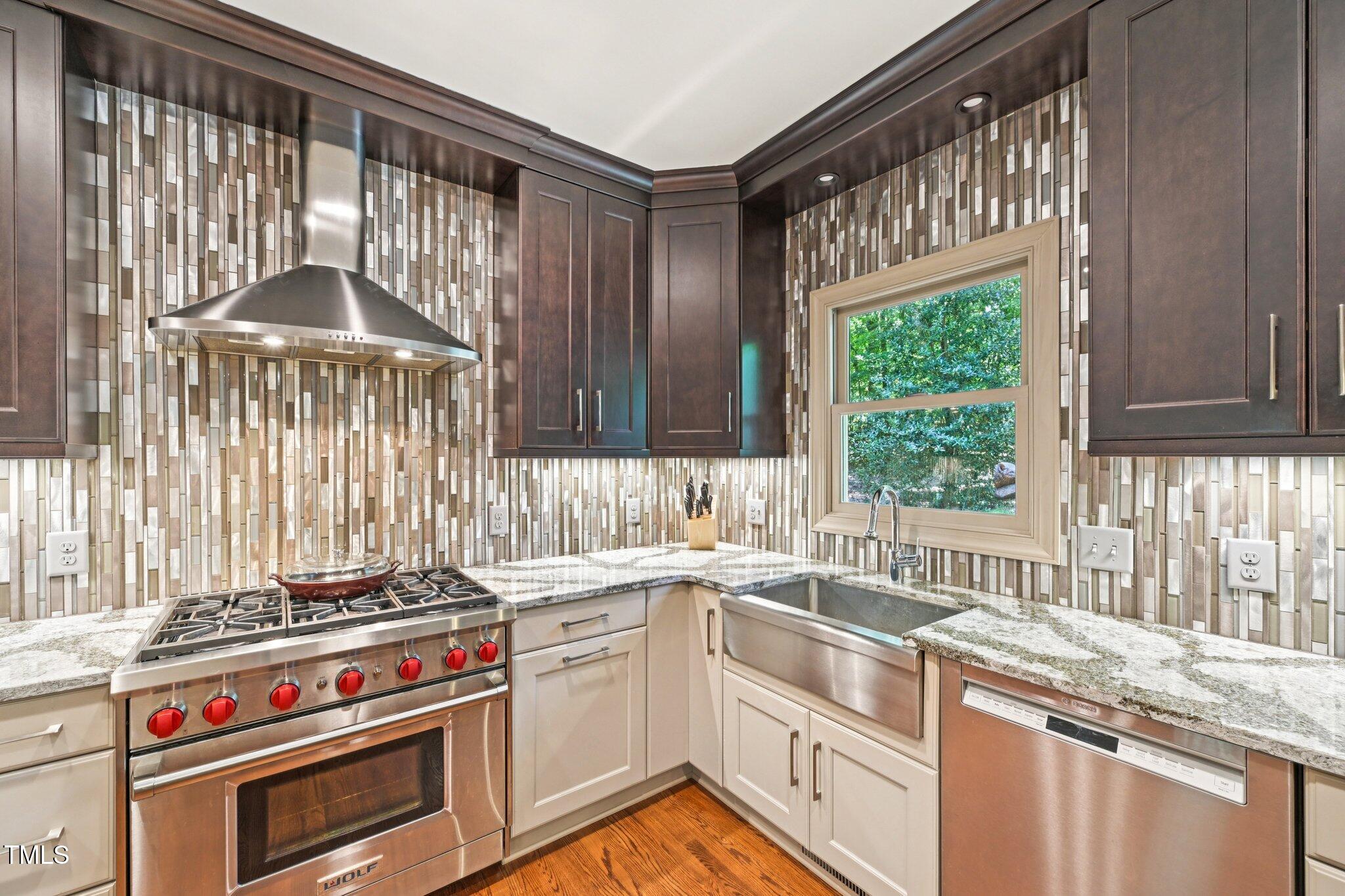 3413 1st Place Raleigh, NC 27613 - Photo 10 of 43 a kitchen with a stove a sink and a window