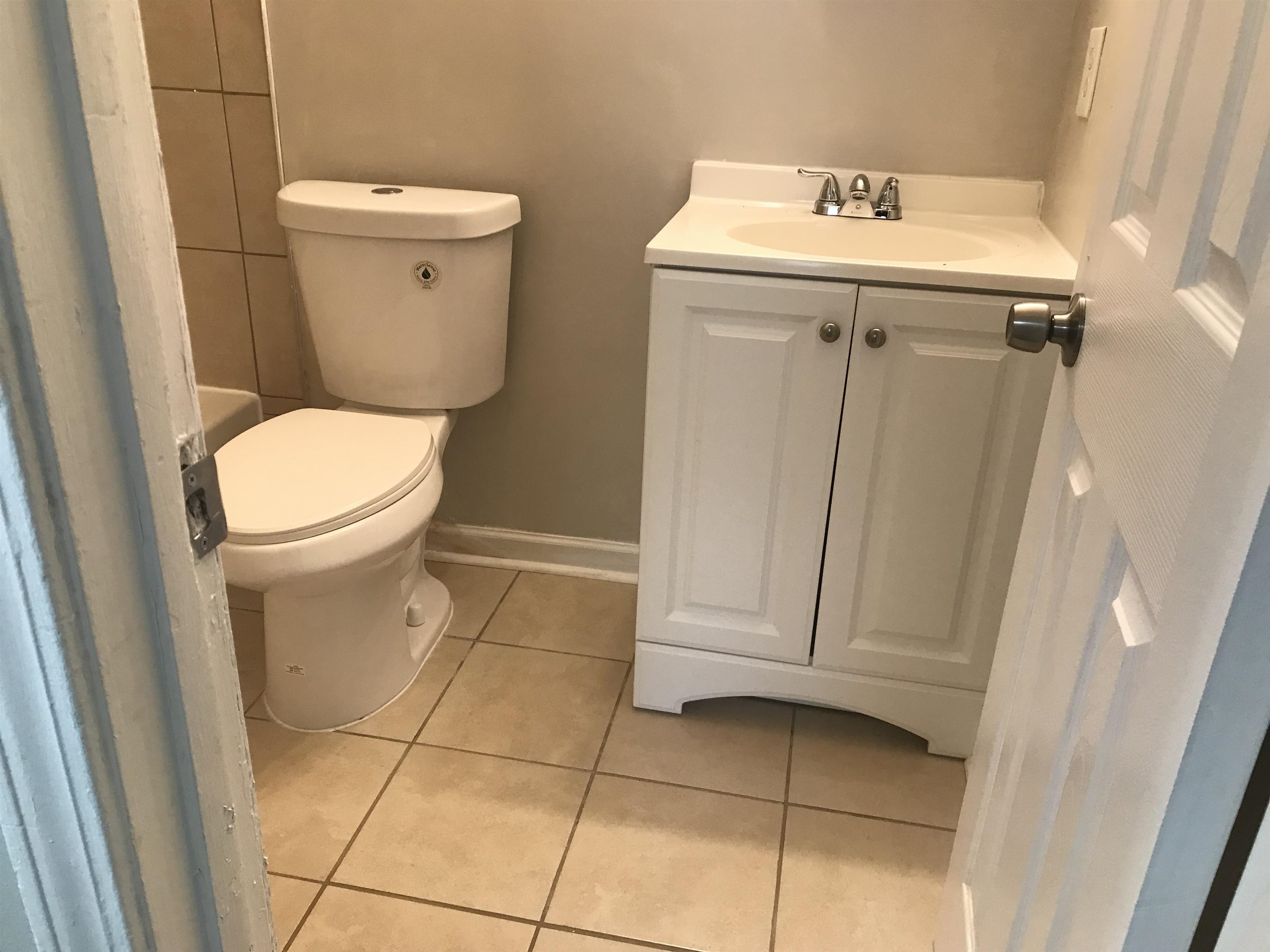 48 South Bristol Road Marion, AR 72364 - Photo 15 of 18 Bathroom featuring light tile patterned floors and vanity