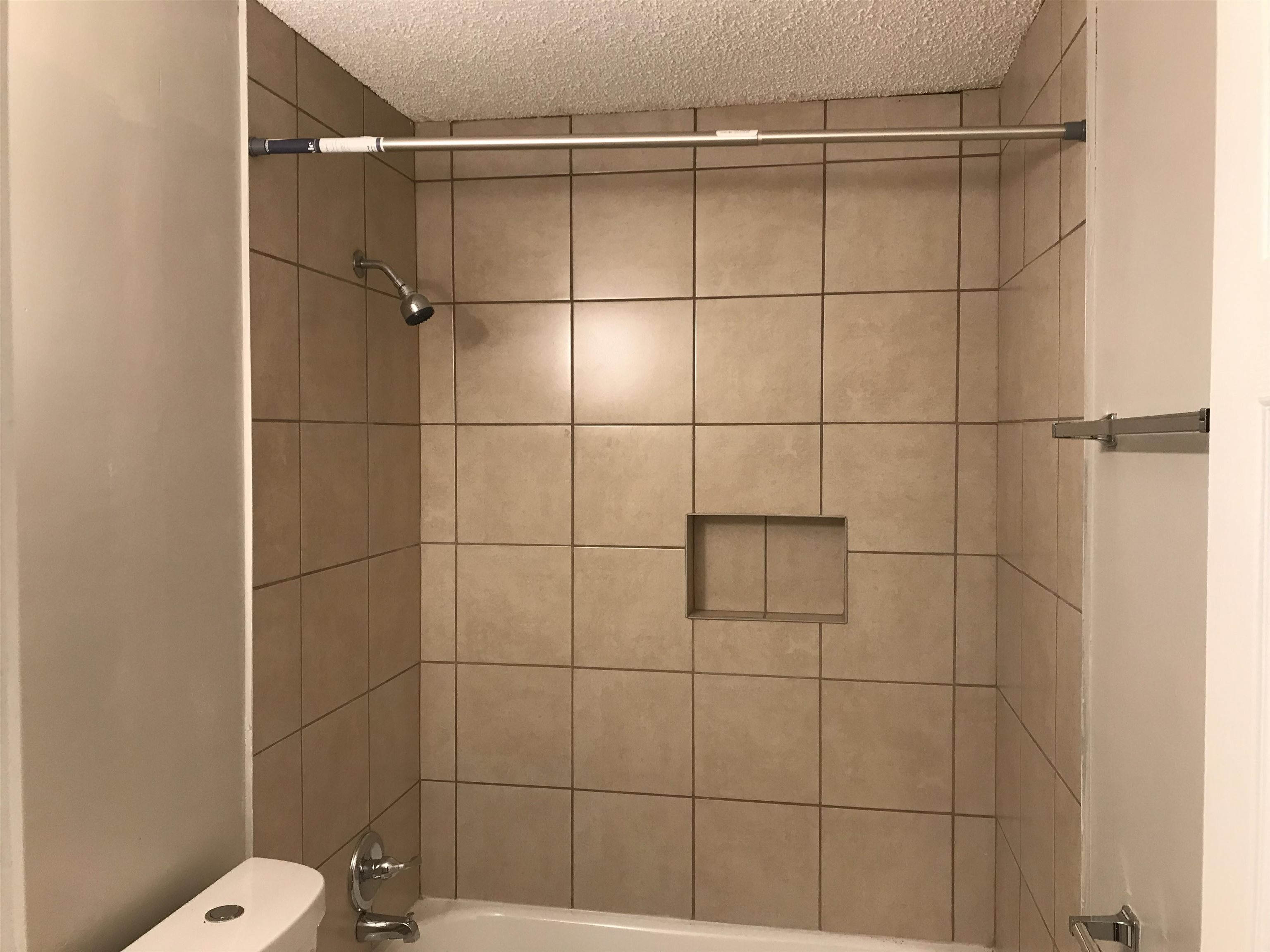 48 South Bristol Road Marion, AR 72364 - Photo 17 of 18 Full bath with bathing tub / shower combination and a textured ceiling